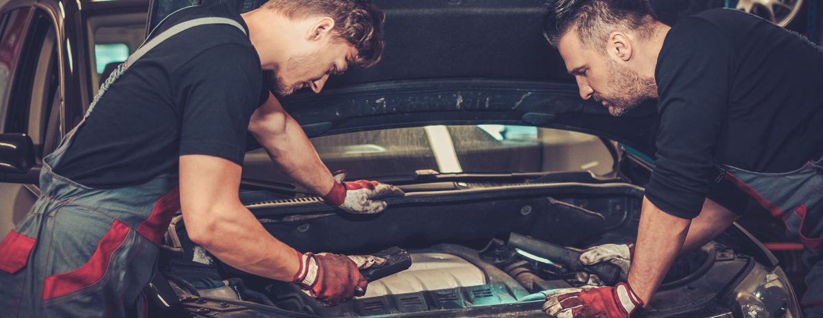 Technician with a spanner preparing to undertaking car servicing at J-Tek in Ely